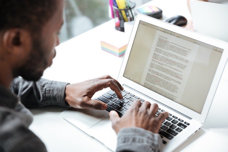 Professional content writer typing copywriting strategy